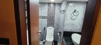 a bathroom with a toilet and a sink at Omni Tower Nana Bangkok - Serviced Apartment on Sukhumvit Soi 4 in Bangkok