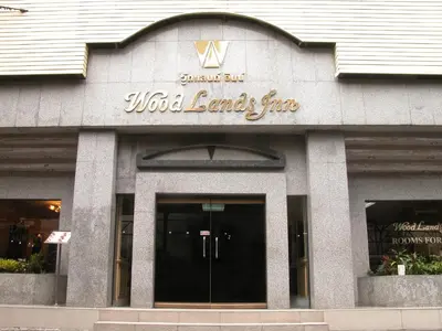 a wild ends fire sign on the front of a building at Woodlands Inn in Bangkok
