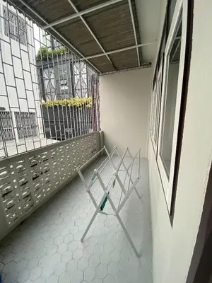 an empty room with a bench and a window at Freedom8 in Khlong San