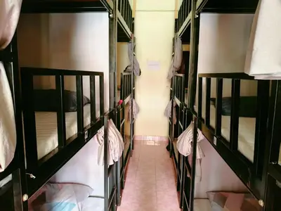 a row of bunk beds in a dorm room at \u66fc\u8c37\u8d75\u5c0f\u59d0\u7684\u5e97MissZhaoHostel in Bangkok