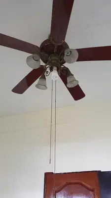 a ceiling fan is hanging from a ceiling at \u66fc\u8c37\u8d75\u5c0f\u59d0\u7684\u5e97MissZhaoHostel in Bangkok