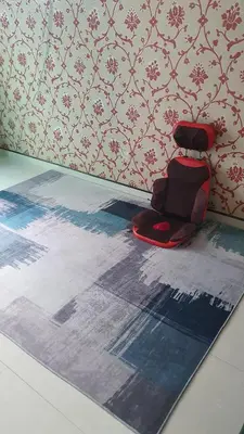 a red chair sitting on a rug in a room at \u66fc\u8c37\u8d75\u5c0f\u59d0\u7684\u5e97MissZhaoHostel in Bangkok