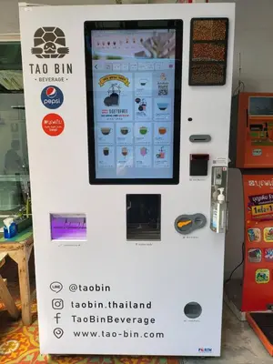 a sign for a tao bim machine in a store at Ratanawong Place 511 in Bangkok