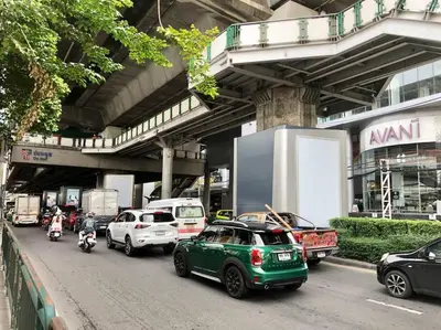 a group of cars parked on a city street at Bang Chak Homestay in Amphoe Phra Khanong