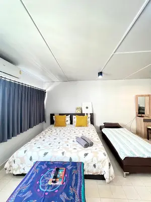 a bedroom with two beds in a room at Lively Impact C3-C9 in Nonthaburi