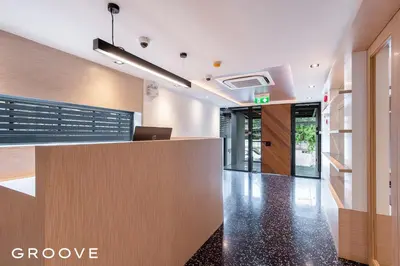 an office with a reception desk and a lobby at GROOVE AT SIAM in Pom Prap