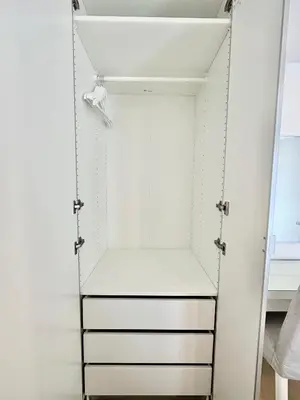 a white closet with a swing in it at Town Sukhumvit 71 in Bangkok