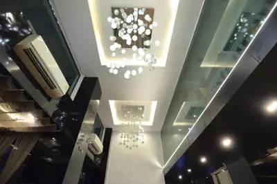 a building with a chandelier on the ceiling at De Lux Bangkok Hotel in Ban Khlong Lat Bua Khao
