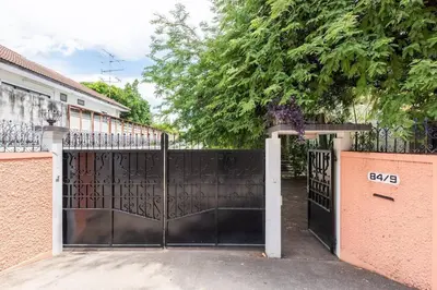 a gate to a house with a fence at OnNut Pool Homestay in Amphoe Phra Khanong