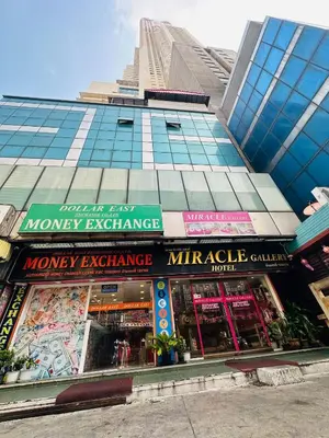 a building with a monopoly exchange in front of it at Miracle Gallery Hotel in Makkasan