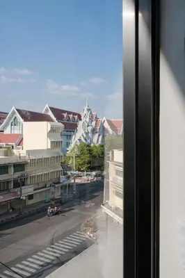a view from a window of a city street at CASA BLANCA Dusit in Dusit