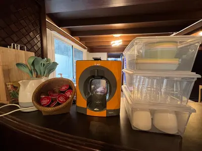 a kitchen counter with an orange box and some food at 77 Old Town in Bangkok