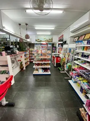 a store aisle with a lot of products on display at Ratanawong Place 513 in Bangkok