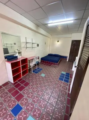 a hospital room with a bed and a mirror at Ratanawong Place 301 in Bangkok