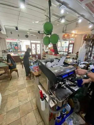 a counter in a restaurant with people in a room at Ratanawong Place 301 in Bangkok