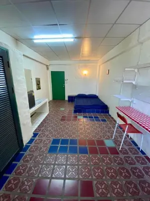a room with a room with a colorful floor at Ratanawong Place 406 in Bangkok