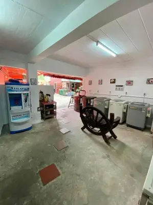 a room with a bunch of old machines in it at Ratanawong Place 444 in Bangkok