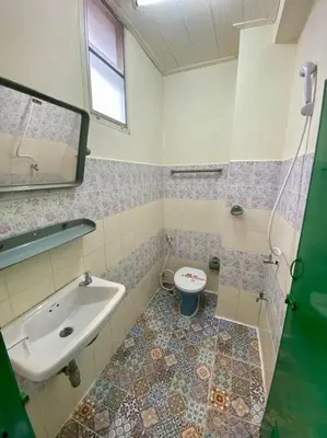 a bathroom with a sink and a toilet at Ratanawong Place 510 in Bangkok