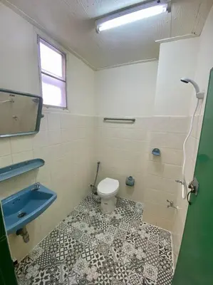 a bathroom with a toilet and a sink at Ratanawong Place 516 in Bangkok
