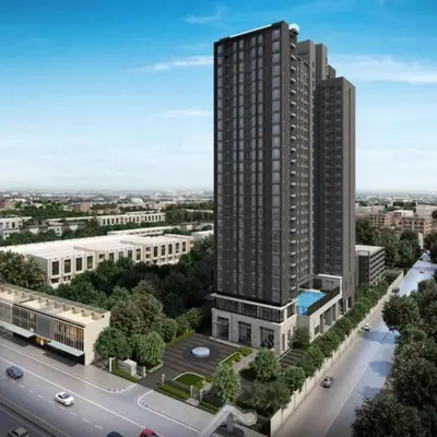 an aerial view of a tall building next to a road at New Condo, Hi-Speed Wi-Fi, Gym Pool, near Lam Sali MRT in Bangkok