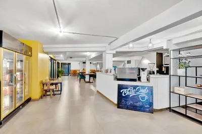 a kitchen with a drink bar in a restaurant at Chill Inn Bangkok in Bang Kapi