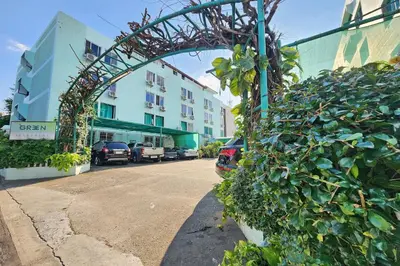 an archway over a street next to a building at Green Apartment Kaset in Bangkok