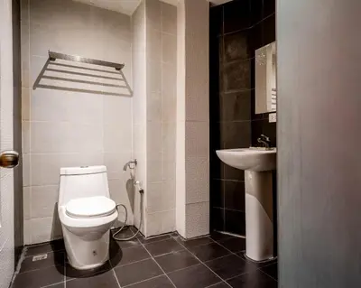 a bathroom with a toilet and a sink at XX GO INN Sukhumvit 20 Bts Asoke-Phrom Phong in Bangkok