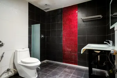 a bathroom with a white toilet and a sink at XX GO INN Sukhumvit 20 Bts Asoke-Phrom Phong in Bangkok