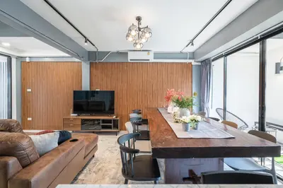 a living room with a table and a couch at S21 Mellow Phromphong in Bangkok
