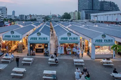 a group of people walking in front of a market at Best Western Ratchada Hotel in Bangkok