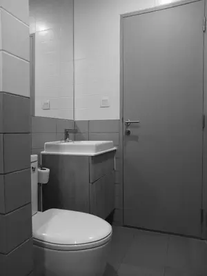 a bathroom with a toilet and a sink and a door at Rooms bangkok nearby Onnut bts in Amphoe Phra Khanong