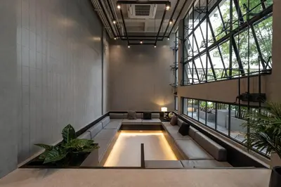 a large living room with a large window at EX2 Hotel in Ban Bang Khen (1)