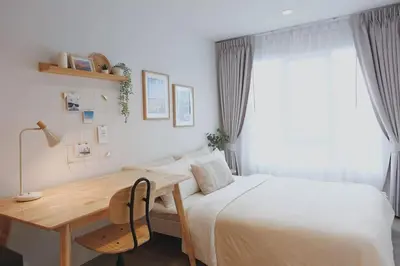 a bedroom with a bed and a desk and a bed at Minimal Cozy Room near Chatuchak Weekend Market #2 in Bangkok