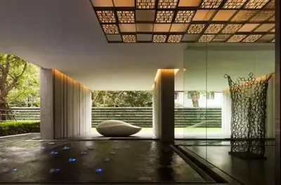 a living room with a large room with a white chair at Luxury 2BR on the Clouds in Prime area Bangkok in Bangkok