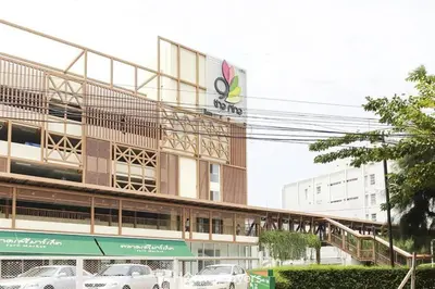a building with cars parked in front of it at Monte Rama 9 near JodFair Market in Bangkok