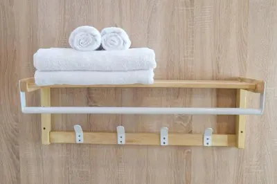 a couple of towels on a wooden shelf in a bathroom at 2BR minimal mu-ji style 130SQM ~ in Makkasan