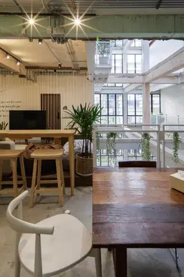 a room with a table and chairs in a room at C'HOUSE Bangkok in Pom Prap